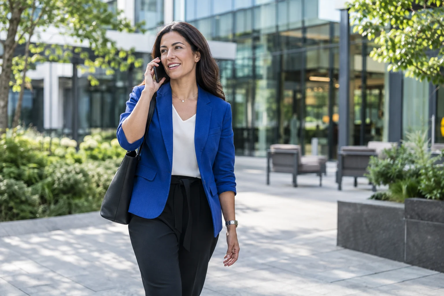 Professional taking a business call away from the desk